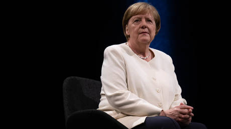 Former German Chancellor Angela Merkel at a Leipzig Book Fair event on a stage at Schauspiel Leipzig.