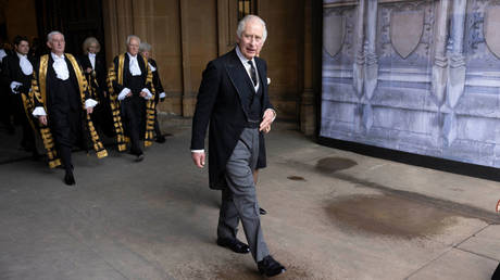 King Charles III leaves Westminster Palace after the presentation of addresses by both houses of Parliament last September in London.