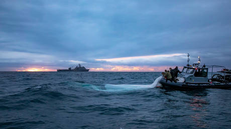 US Navy sailors recover the 'Chinese spy balloon' off the coast of South Carolina, February 5, 2023