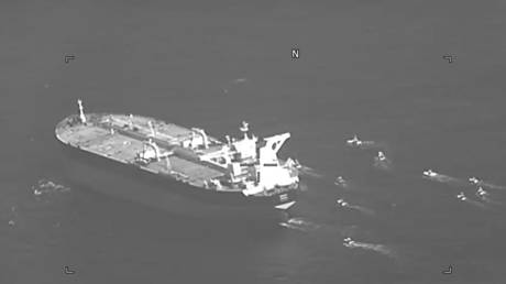 The Panama-flagged oil tanker Niovi is surrounded by Iranian Revolutionary Guard vessels in the Strait of Hormuz, May 3, 2023