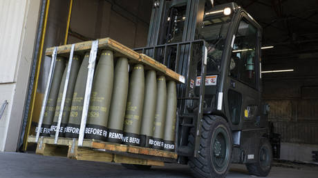 US Airmen use a forklift to move 155 mm shells ultimately bound for Ukraine, at Dover Air Force Base, Delaware, April 29, 2022 April 29, 2022