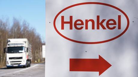 A truck drives past a board with a logo of German manufacturer Henkel outside its beauty care plant in Noginsk outside Moscow, Russia.