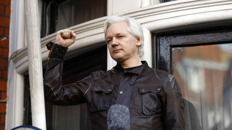 Julian Assange greets supporters outside the Ecuadorian embassy in London, Britain, May 19, 2017