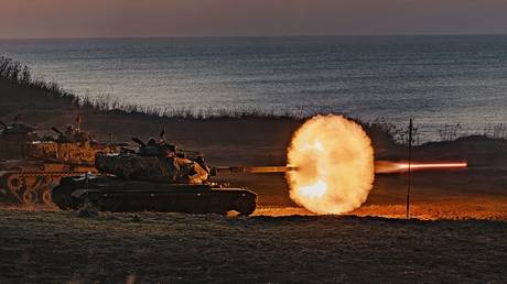 FILE PHOTO: A Taiwanese tank fires during a military drill at an undisclosed location in Taiwan.