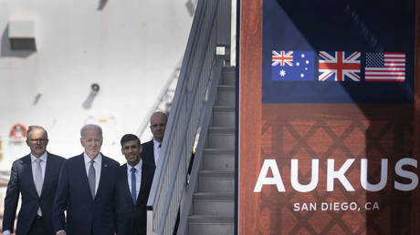 FILE PHOTO: UK Prime Minister Rishi Sunak (R), US President Joe Biden (C) and Australian premier Anthony Albanese are seen at Point Loma naval base in San Diego, California, March 13, 2023.
