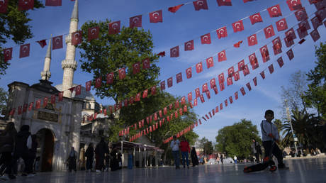 Turkish flags hang next to the Eyub Sultan mosque in Istanbul, Türkiye, May 8, 2023