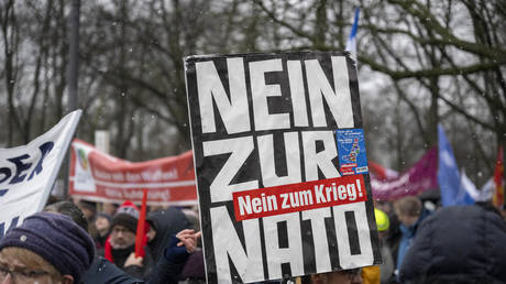 FILE PHOTO: A placard reading 'No to NATO, No to War' at a rally in Berlin, Germany, on February 25, 2023.