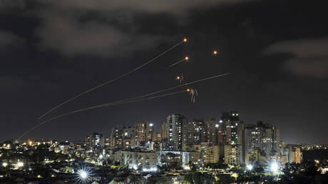 Israel's Iron Dome missile defense system fires interceptors at rockets launched from the Gaza Strip, in Ashkelon, southern Israel, May 13, 2023