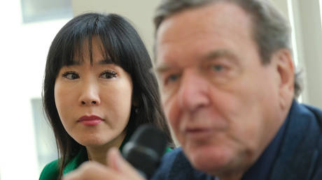 Former German Chancellor Gerhard Schroeder, accompanied by his wife, So-yeon Kim-Schroeder