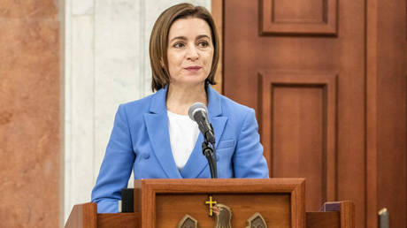 Moldovan President Maia Sandu delivers a speech during a swearing-in ceremony for the new government at the presidential palace in Chisinau, Moldova.