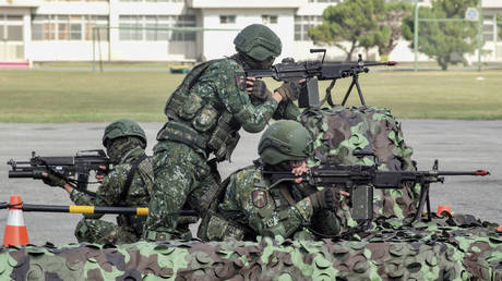 Taiwanese soldiers demonstrate their combat skills during a visit by Taiwan's President Tsai Ing-wen at a military base in Chiayi on January 6, 2023.