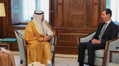 This handout picture released by the Syrian Presidency Telegram account on May 10, 2023 shows Syrian President Bashar al-Assad meeting with Saudi's ambassador to Jordan, Nayef bin Bandar Al-Sudairy, in Damascus.