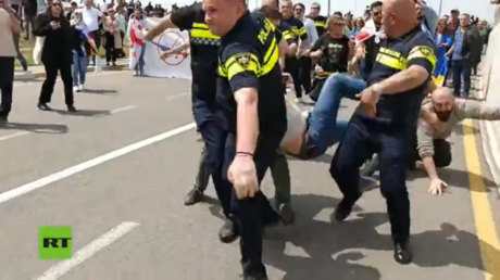 Police intervene as pro-Western mob targets Russian visitors