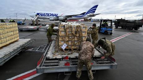 FILE PHOTO: Ukrainian troops unloading US military aid at an airport in Kiev.