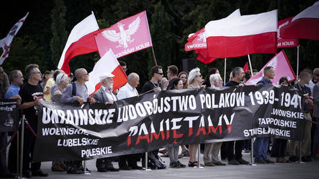 FILE PHOTO: People in Poland hold a rally to commemorate the victims of the Volyn massacre in Warsaw, Poland, on July 14, 2019.
