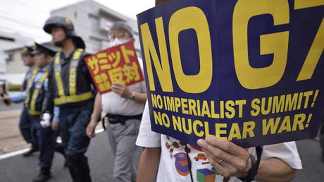 People demonstrate on May 20, 2023 in Hiroshima city, Japan, as they protest against the G7 Hiroshima Summit