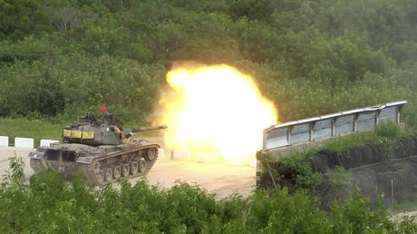 FILE PHOTO: A Taiwanese tank fires at targets during a military exercise in Hengchun, Taiwan, September 7, 2022.