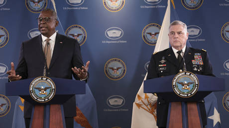 US Defense Secretary Lloyd Austin (L) and Army Gen. Mark Milley, chairman of the Joint Chiefs of Staff speak during a news conference at the Pentagon.
