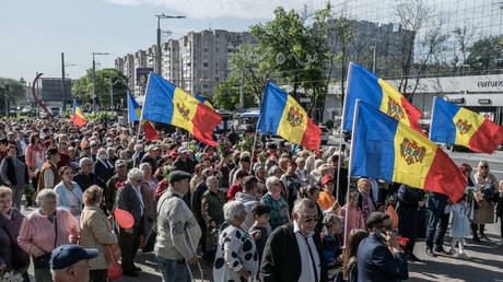 FILE PHOTO: People holding national flags celebrate Victory Day in Chisinau, Moldova, on May 9, 2022.