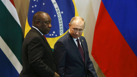 FILE PHOTO: South Africa's President Cyril Ramaphosa, left, and Russia's President Vladimir Putin, arrive for the Leaders Dialogue with BRICS Business Council and the New Development Bank, at the Itamaraty Palace in Brasilia, Brazil, Thursday, Nov. 14, 2019.