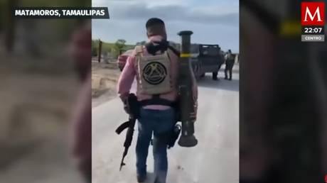 A member of the Cartel Del Golfo (CDG) in Tamaulipas, Mexico carrying a US-made anti-tank weapon, as shown on Mexican TV channel Milenio, May 30, 2023