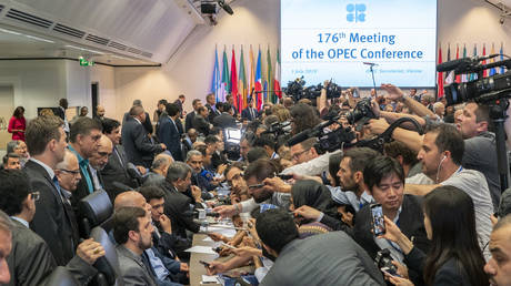 FILE PHOTO: Journalists interview officials at an OPEC meeting in Vienna, Austria, 2019.