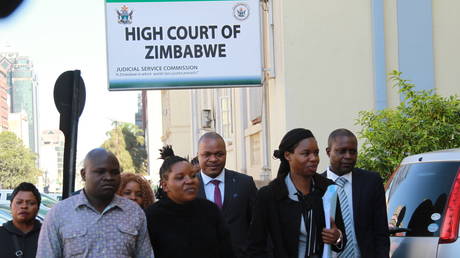 Members of the Broad Alliance Against Sanctions (BAAS), Zimbabwe's anti-sanctions lobby group, and their legal team arrive at the High Court to file a court application seeking reparations from the United States for imposing sanctions on Zimbabwe, in Harare, Zimbabwe, May 29, 2023.