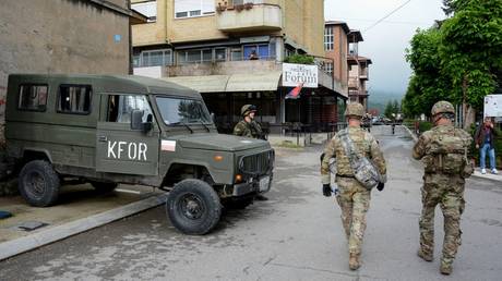 NATO soldiers patrol the streets in Zvecan, Kosovo, June 1, 2023.