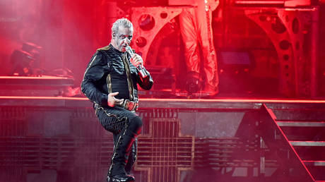 18 June 2022, North Rhine-Westphalia, Duesseldorf: Rammstein lead singer Till Lindemann performs the song "Deutschland" on stage