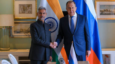 Russian Foreign Minister Sergey Lavrov shakes hands with his India's counterpart Subrahmanyam Jaishankar.