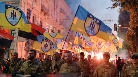 FILE PHOTO: Ukrainian nationalists and servicemen of the Azov battalion demonstrate in Kiev.