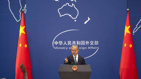 FILE PHOTO: Chinese Foreign Ministry spokesman Wang Wenbin gestures during a press conference in Beijing, May 9, 2023.