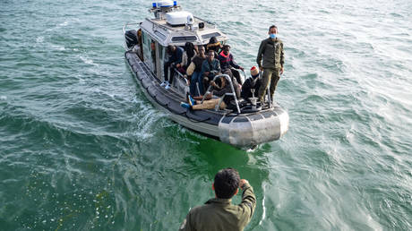 The Tunisian Maritime National Guard intercept boats of migrants trying to cross the Mediterranean Sea before returning the migrants to the shore of the Tunisian southern city of Sfax on June 9, 2023.