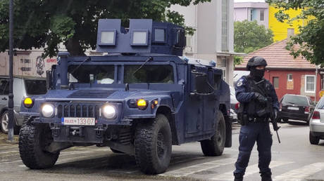 A Kosovo police officer stands guard in Zvecan, Kosovo, May 26, 2023