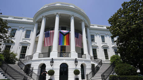 A 'Progress Pride' flag hangs from the White House during a Pride Month celebration on the South Lawn, June 10, 2023, in Washington, DC.