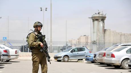 FILE PHOTO: Members of the Israeli security forces work at the site.