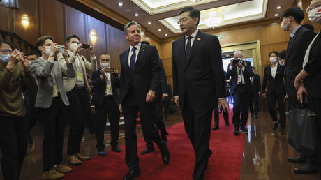 U.S. Secretary of State Antony Blinken, center, left, walks with Chinese Foreign Minister Qin Gang, center right, at the Diaoyutai State Guesthouse in Beijing, China, Sunday, June 18, 2023.