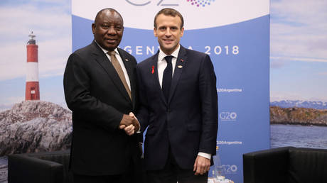 FILE PHOTO. France's President Emmanuel Macron (R) and South Africa's President Cyril Ramaphosa.