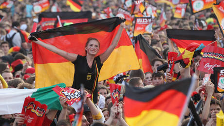 FILE PHOTO: Fans wave German flags.