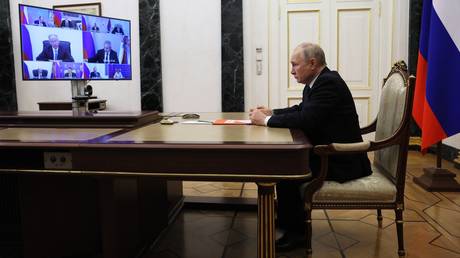 Russian President Vladimir Putin chairs a Security Council meeting via video link.