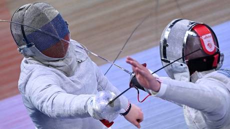 FILE PHOTO: Russia's Nikolai Spitsyn (L) and Belarus' Kiryl Abushenka compete in the international fencing event Moscow Sabre in Moscow, Russia, May 27, 2023