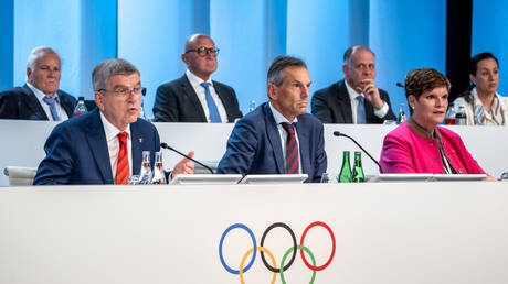 International Olympic Committee executive board members headed by IOC President Thomas Bach take part in an extraordinary IOC Session on June 22, 2023, Lausanne, Switzerland