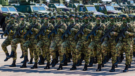 FILE PHOTO: Serbian soldiers march during a ceremony marking the Armed Forces Day.
