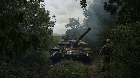 FILE PHOTO. A Ukrainian tank rides along a road near Artyomovsk/Bakhmut in Russia's Donetsk region.