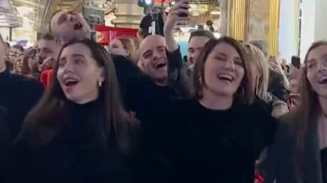 A still frame from a social media video showing graduates singing 'I am Russian' by Shaman