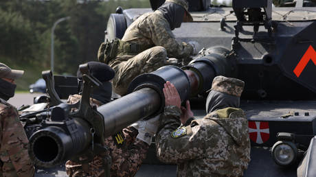 FILE PHOTO: A Ukrainian tank crew receives training on the maintenance of Leopard 1A5 main battle tanks in Germany.