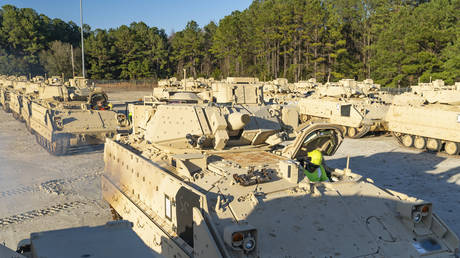 Bradley Infantry Fighting Vehicles await loading onto a transport ship in North Charleston, South Carolina, January 25, 2023