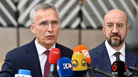 NATO Secretary General Jens Stoltenberg talks to the media as he arrives with European Council President Charles Michel for a European Council Summit, on June 29, 2023.