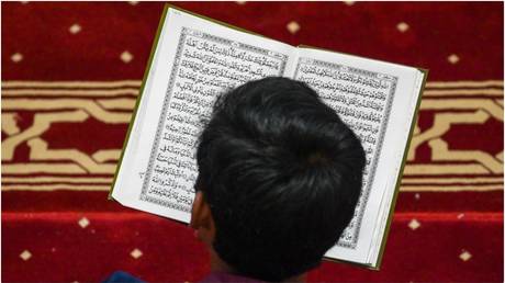 A man reads the Koran.