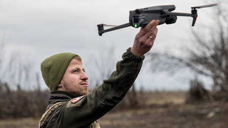 FILE PHOTO: A Ukrainian serviceman flies a drone